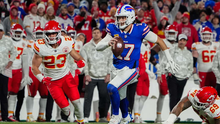 Buffalo Bills quarterback Josh Allen (17) runs with the ball for a touchdown against Kansas City Chiefs linebacker Drue Tranquill (23) 