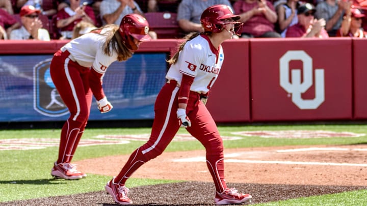 Oklahoma outfielder Abby Dayton celebrates after scoring a run against Binghamton.
