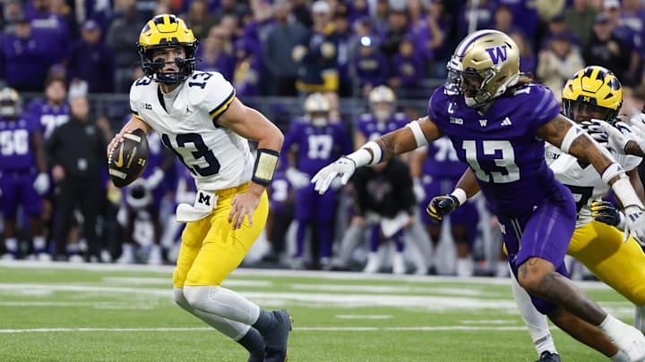 Oct 5, 2024; Seattle, Washington, USA; Michigan Wolverines quarterback Jack Tuttle (13) looks to pass against the Washington Huskies during the third quarter at Alaska Airlines Field at Husky Stadium.