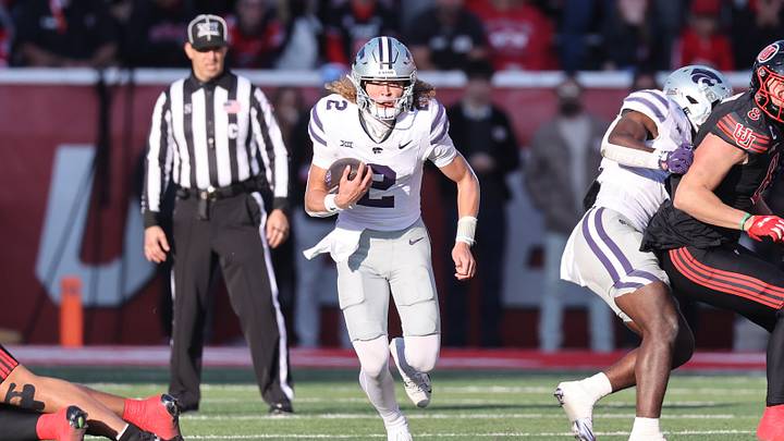 Nov 22, 2025; Salt Lake City, Utah, USA; Kansas State Wildcats quarterback Avery Johnson (2) runs the ball against the Utah Utes during the first half at Rice-Eccles Stadium. Mandatory Credit: Rob Gray-Imagn Images Nov 22, 2025; Salt Lake City, Utah, USA; Kansas State Wildcats quarterback Avery Johnson (2) runs the ball against the Utah Utes during the first half at Rice-Eccles Stadium. Mandatory Credit: Rob Gray-Imagn Images