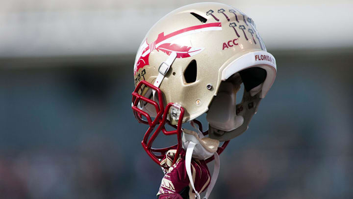 Nov 9, 2013; Winston-Salem, NC, USA; A Florida State Seminoles player holds up a helmet prior to kickoff against the Wake Forest Demon Deacons at BB&T Field. Mandatory Credit: Jeremy Brevard-Imagn Images