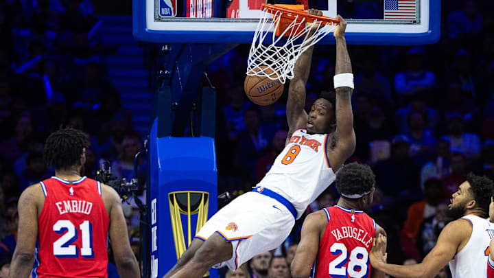 Nov 12, 2024; Philadelphia, Pennsylvania, USA; New York Knicks forward OG Anunoby (8) dunks the ball in front of Philadelphia 76ers center Joel Embiid (21) and forward Guerschon Yabusele (28) during the fourth quarter at Wells Fargo Center. Mandatory Credit: Bill Streicher-Imagn Images Nov 12, 2024; Philadelphia, Pennsylvania, USA; New York Knicks forward OG Anunoby (8) dunks the ball in front of Philadelphia 76ers center Joel Embiid (21) and forward Guerschon Yabusele (28) during the fourth quarter at Wells Fargo Center. Mandatory Credit: Bill Streicher-Imagn Images