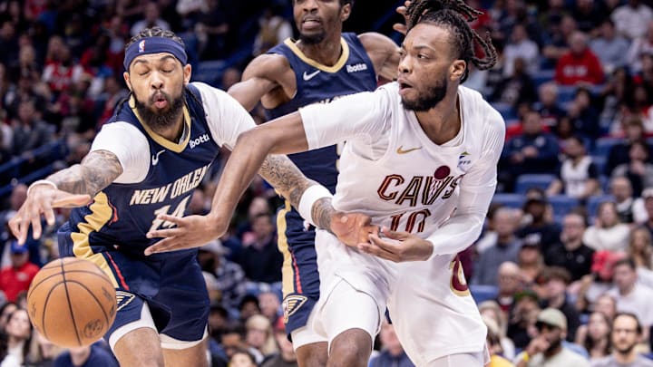 Mar 13, 2024; New Orleans, Louisiana, USA;  Cleveland Cavaliers guard Darius Garland (10) looks to pass the ball against New Orleans Pelicans forward Brandon Ingram (14) during the first half at Smoothie King Center. Mandatory Credit: Stephen Lew-Imagn Images