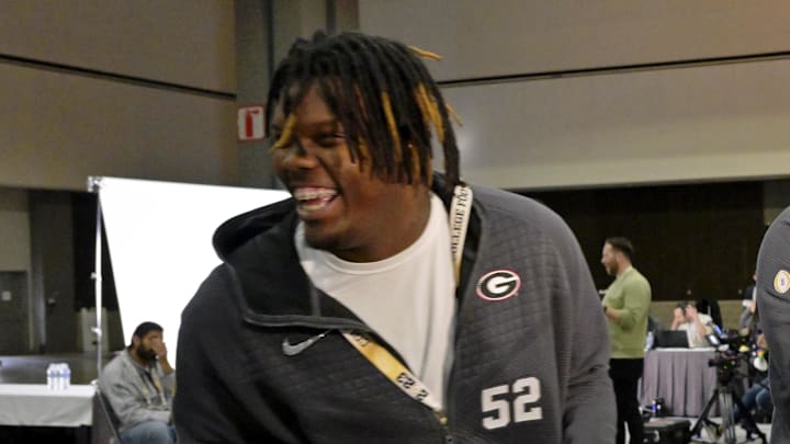 Jan 7, 2023; Los Angeles, California, USA; Georgia Bulldogs defensive lineman Warren Brinson (97) reacts while interviewing defensive lineman Christen Miller (52) on media day before the 2023 CFP National Championship game at Los Angeles Convention Center. Mandatory Credit: Jayne Kamin-Oncea-Imagn Images Jan 7, 2023; Los Angeles, California, USA; Georgia Bulldogs defensive lineman Warren Brinson (97) reacts while interviewing defensive lineman Christen Miller (52) on media day before the 2023 CFP National Championship game at Los Angeles Convention Center. Mandatory Credit: Jayne Kamin-Oncea-Imagn Images