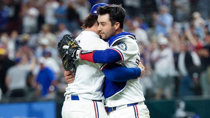 Texas Rangers relief pitcher Jakob Junis (16) celebrates with Texas Rangers catcher Kyle Higashioka (11) after the game.  Credit: Kevin Jairaj-Imagn Images
