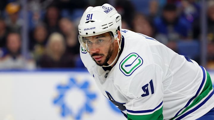 Jan 6, 2026; Buffalo, New York, USA;  Vancouver Canucks left wing Evander Kane (91) waits for the face-off during the third period against the Buffalo Sabres at KeyBank Center. Mandatory Credit: Timothy T. Ludwig-Imagn Images