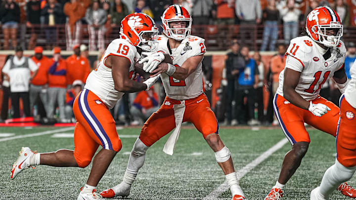 Clemson quarterback Cade Klubnik (2) hands the ball off to running back Keith Adams Jr. (19) during the game against the Texas Longhorns in the first round of the College Football Playoffs at Darrell K Royal-Texas Memorial Stadium on Saturday, Dec. 21, 2024. Clemson quarterback Cade Klubnik (2) hands the ball off to running back Keith Adams Jr. (19) during the game against the Texas Longhorns in the first round of the College Football Playoffs at Darrell K Royal-Texas Memorial Stadium on Saturday, Dec. 21, 2024.
