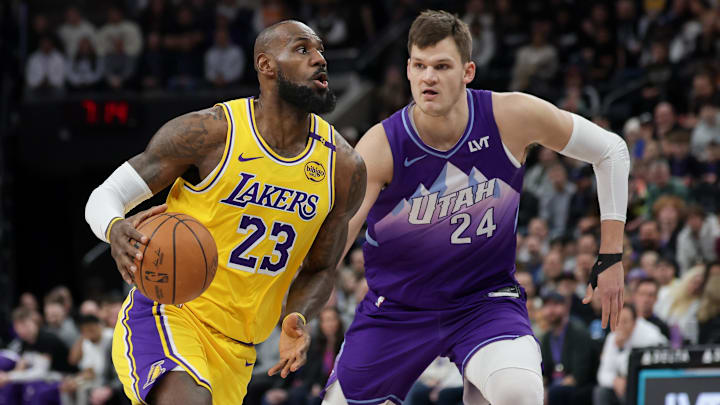 Feb 12, 2025; Salt Lake City, Utah, USA; Los Angeles Lakers forward LeBron James (23) dribbles past Utah Jazz center Walker Kessler (24) during the first quarter at Delta Center. Mandatory Credit: Chris Nicoll-Imagn Images Feb 12, 2025; Salt Lake City, Utah, USA; Los Angeles Lakers forward LeBron James (23) dribbles past Utah Jazz center Walker Kessler (24) during the first quarter at Delta Center. Mandatory Credit: Chris Nicoll-Imagn Images
