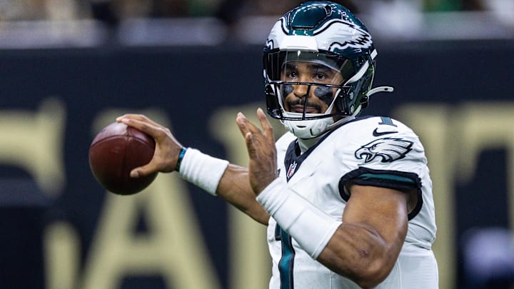 Sep 22, 2024; New Orleans, Louisiana, USA; Philadelphia Eagles quarterback Jalen Hurts (1) passes against the New Orleans Saints during the first half at Caesars Superdome. Mandatory Credit: Stephen Lew-Imagn Images