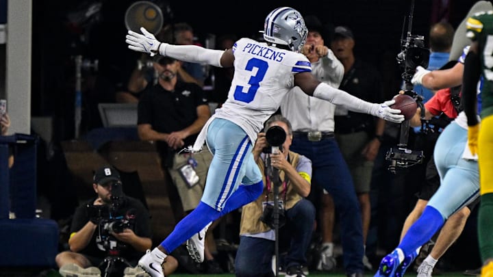 Dallas Cowboys WR George Pickens celebrates in the end zone after he catches a touchdown against the Green Bay Packers.
