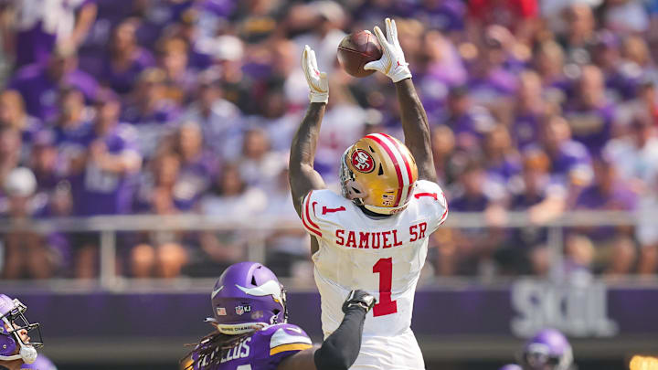 Sep 15, 2024; Minneapolis, Minnesota, USA; San Francisco 49ers wide receiver Deebo Samuel Sr. (1) catches the ball against the Minnesota Vikings safety Josh Metellus (44) in the second quarter at U.S. Bank Stadium. Mandatory Credit: Brad Rempel-Imagn Images