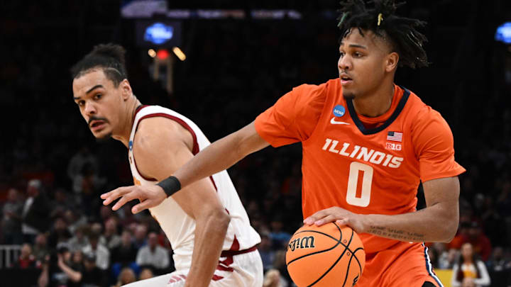 Mar 28, 2024; Boston, MA, USA; Illinois Fighting Illini guard Terrence Shannon Jr. (0) dribbles the ball through the Iowa State defense.