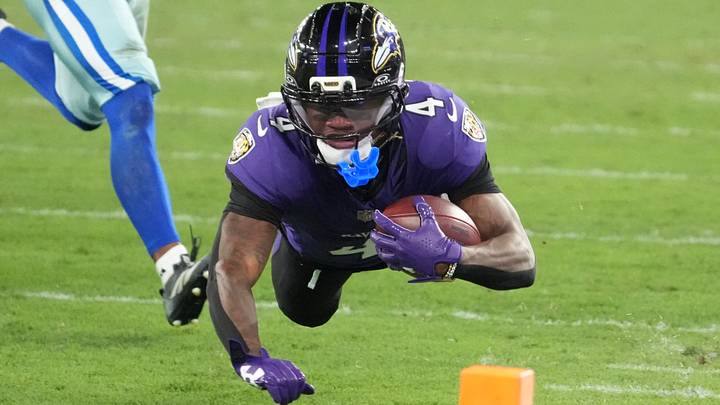 Sep 27, 2026; Rio De Janeiro, BRA;  Baltimore Ravens wide receiver Zay Flowers (4) dives with the ball during the game against the Dallas Cowboys at Maracana Stadium.  Mandatory Credit: Kirby Lee-Imagn Images