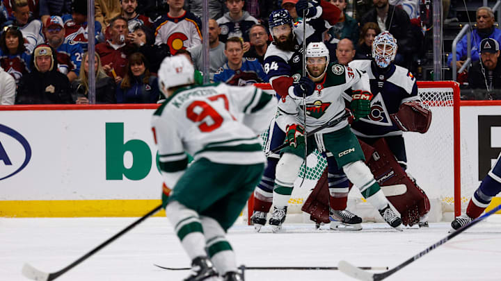 Mar 8, 2026; Denver, Colorado, USA; Colorado Avalanche defenseman Brent Burns (84) and Minnesota Wild right wing Ryan Hartman (38) battle for position in front of goaltender Scott Wedgewood (41) as left wing Kirill Kaprizov (97) controls the puck in the second period at Ball Arena. Mandatory Credit: Isaiah J. Downing-Imagn Images