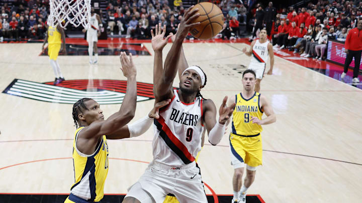 Jan 19, 2024; Portland, Oregon, USA; Portland Trail Blazers small forward Jerami Grant (9) drives to the basket against Indiana Pacers shooting guard Bennedict Mathurin (00) during the first half at Moda Center. Mandatory Credit: Soobum Im-Imagn Images