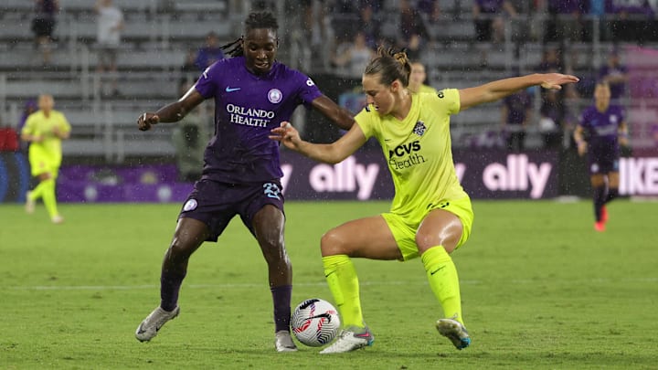 Orlando Pride forward Barbra Banda (22) and Washington Spirit defender Tara McKeown (9) battle for the ball  