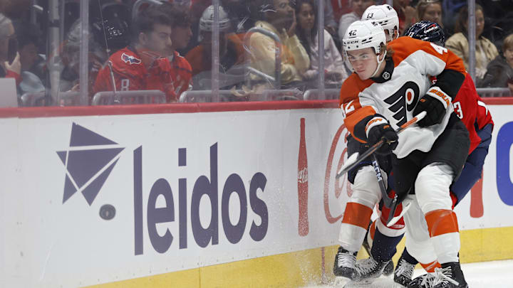 Sep 22, 2024; Washington, District of Columbia, USA; Philadelphia Flyers defenseman Spencer Gill (42) clears the puck from Washington Capitals forward Jakub Vrana (13) in the third period at Capital One Arena.  Sep 22, 2024; Washington, District of Columbia, USA; Philadelphia Flyers defenseman Spencer Gill (42) clears the puck from Washington Capitals forward Jakub Vrana (13) in the third period at Capital One Arena.