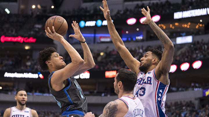 Apr 1, 2019; Dallas, TX, USA; Dallas Mavericks forward Justin Jackson (44) shoots the ball over Philadelphia 76ers guard JJ Redick (17) and forward Jonah Bolden (43) during the second quarter at the American Airlines Center. Mandatory Credit: Jerome Miron-Imagn Images