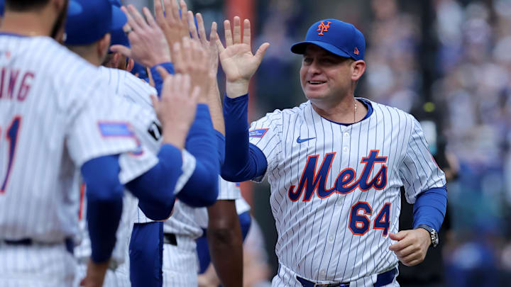 Apr 4, 2025; New York City, New York, USA; New York Mets manager Carlos Mendoza (64) is introduced before the Mets home opener against the Toronto Blue Jays at Citi Field. Mandatory Credit: Brad Penner-Imagn Images Apr 4, 2025; New York City, New York, USA; New York Mets manager Carlos Mendoza (64) is introduced before the Mets home opener against the Toronto Blue Jays at Citi Field. Mandatory Credit: Brad Penner-Imagn Images