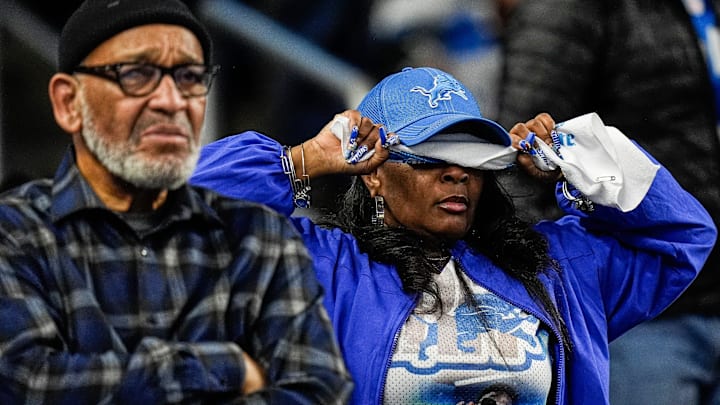 A Detroit Lions fan covers her eye before a play against Pittsburgh Steelers during the second half at Ford Field 