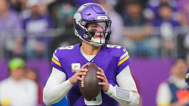 Minnesota Vikings quarterback J.J. McCarthy (9) drops back to pass against the Baltimore Ravens in the second quarter at U.S. Bank Stadium. 