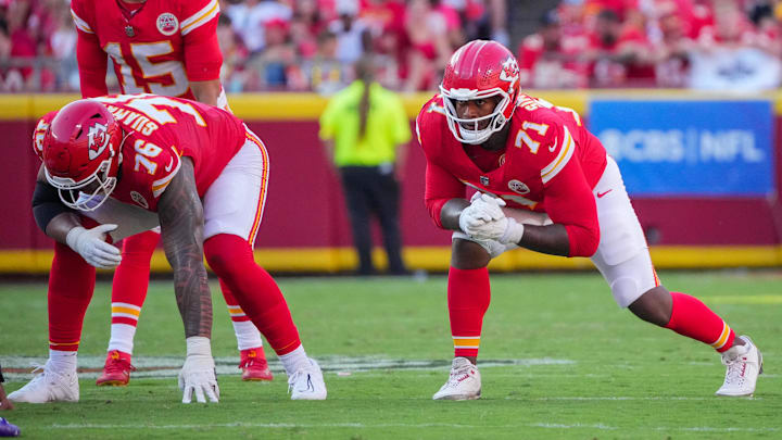 Sep 28, 2025; Kansas City, Missouri, USA; Kansas City Chiefs offensive tackle Kingsley Suamataia (76) and offensive tackle Josh Simmons (71) at the line of scrimmage against the Baltimore Ravens during the game at GEHA Field at Arrowhead Stadium. Mandatory Credit: Denny Medley-Imagn Images