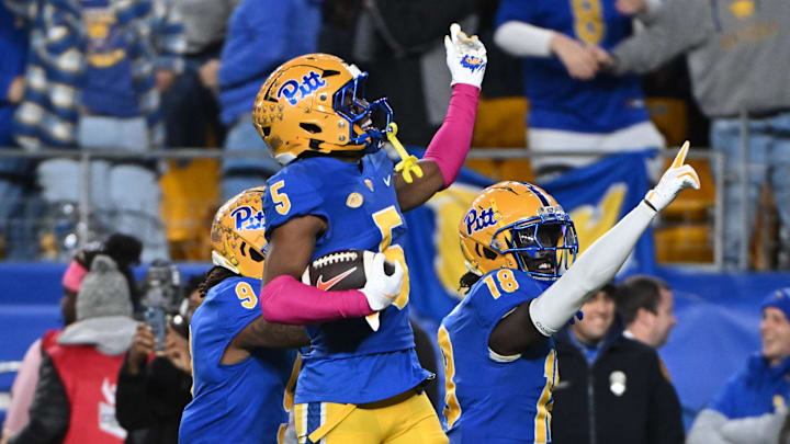 Oct 24, 2024; Pittsburgh, Pennsylvania, USA; Pittsburgh Panthers defensive back Phillip O'Brien Jr. (5) celebrates an interception against the Syracuse Orange during the third quarter at Acrisure Stadium. Mandatory Credit: Barry Reeger-Imagn Images