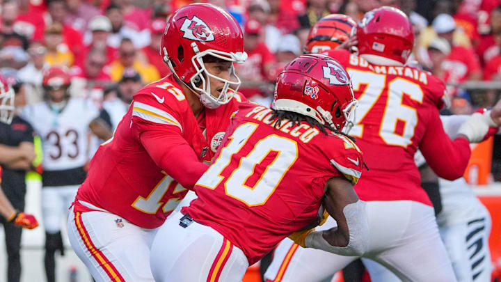 Sep 15, 2024; Kansas City, Missouri, USA; Kansas City Chiefs quarterback Patrick Mahomes (15) hands off to running back Isiah Pacheco (10) against the Cincinnati Bengals during the game at GEHA Field at Arrowhead Stadium. Mandatory Credit: Denny Medley-Imagn Images