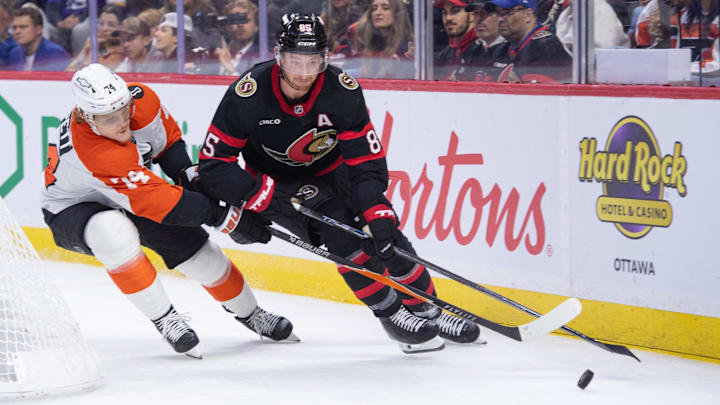 Oct 23, 2025; Ottawa, Ontario, CAN; Philadelphia Flyers right wing Owen Tippett (74) and Ottawa Senators defenseman Jake Sanderson (85) battle for control of the puck in the second period at the Canadian Tire Centre. Mandatory Credit: Marc DesRosiers-IMAGN Images Oct 23, 2025; Ottawa, Ontario, CAN; Philadelphia Flyers right wing Owen Tippett (74) and Ottawa Senators defenseman Jake Sanderson (85) battle for control of the puck in the second period at the Canadian Tire Centre. Mandatory Credit: Marc DesRosiers-IMAGN Images