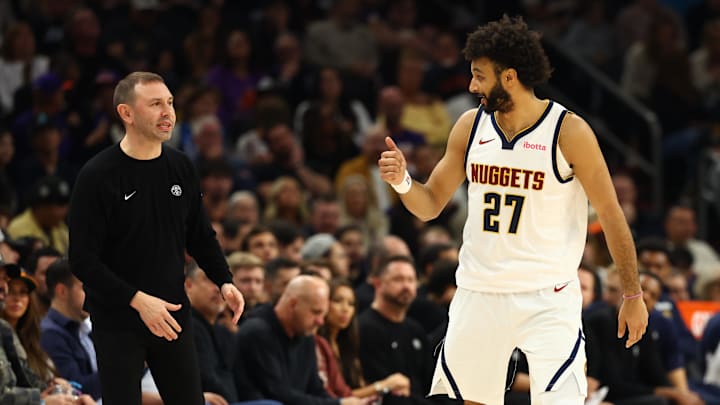 Nov 29, 2025; Phoenix, Arizona, USA; Denver Nuggets head coach David Adelman talks with guard Jamal Murray (27) against the Phoenix Suns in the first half at the Mortgage Matchup Center. Mandatory Credit: Mark J. Rebilas-Imagn Images