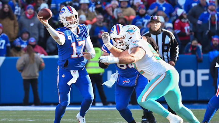 Buffalo Bills quarterback Josh Allen (17) throws a pass against Miami Dolphins defensive tackle Zach Sieler (92) in the second quarter of a wild card game at Highmark Stadium. Buffalo Bills quarterback Josh Allen (17) throws a pass against Miami Dolphins defensive tackle Zach Sieler (92) in the second quarter of a wild card game at Highmark Stadium.