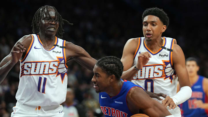 Oct 11, 2024; Phoenix, Arizona, USA; Phoenix Suns center Bol Bol (11) and Phoenix Suns forward Ryan Dunn (0) guard Detroit Pistons guard Jaden Ivey (23) during the second half at Footprint Center. Mandatory Credit: Joe Camporeale-Imagn Images
