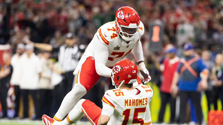 Feb 9, 2025; New Orleans, LA, USA;  Kansas City Chiefs offensive tackle Jawaan Taylor (74) helps up quarterback Patrick Mahomes (15) against the Philadelphia Eagles in Super Bowl LIX at Ceasars Superdome. Mandatory Credit: Mark J. Rebilas-Imagn Images