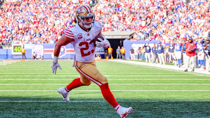 Nov 2, 2025; East Rutherford, New Jersey, USA; San Francisco 49ers running back Christian McCaffrey (23) runs after the catch for a touchdown against the New York Giants during the first half at MetLife Stadium. Mandatory Credit: Ed Mulholland-Imagn Images