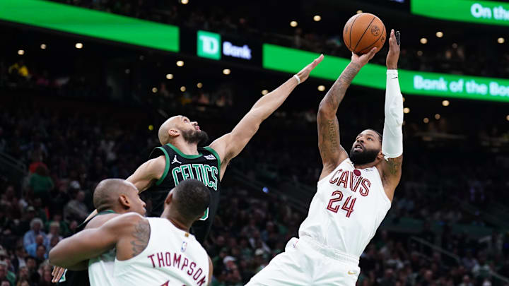 May 15, 2024; Boston, Massachusetts, USA; Cleveland Cavaliers forward Marcus Morris Sr. (24) shoots against Boston Celtics guard Derrick White (9) in the second quarter during game five of the second round for the 2024 NBA playoffs at TD Garden. Mandatory Credit: David Butler II-Imagn Images