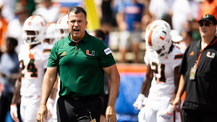 Aug 31, 2024; Gainesville, Florida, USA; Miami Hurricanes head coach Mario Cristobal reacts before a game against the Florida Gators at Ben Hill Griffin Stadium. Mandatory Credit: Matt Pendleton-Imagn Images