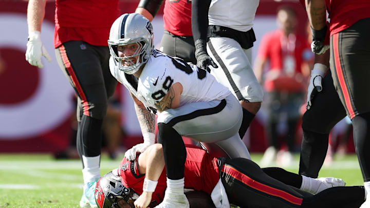 Dec 8, 2024; Tampa, Florida, USA; Las Vegas Raiders defensive end Maxx Crosby (98) sacks Tampa Bay Buccaneers quarterback Baker Mayfield (6) in the second quarter at Raymond James Stadium. Mandatory Credit: Nathan Ray Seebeck-Imagn Images Dec 8, 2024; Tampa, Florida, USA; Las Vegas Raiders defensive end Maxx Crosby (98) sacks Tampa Bay Buccaneers quarterback Baker Mayfield (6) in the second quarter at Raymond James Stadium. Mandatory Credit: Nathan Ray Seebeck-Imagn Images