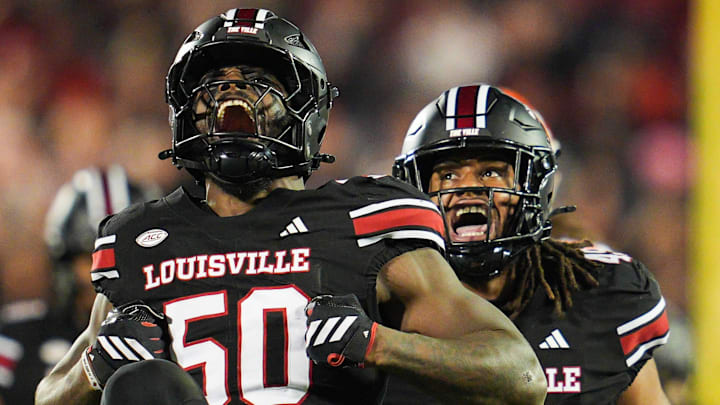 Louisville Cardinals defensive lineman Clev Lubin (50) celebrates his tackle of Clemson Tigers quarterback Cade Klubnik (2) in the first half at L&N Stadium Friday, Nov. 14, 2025.