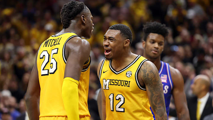 Missouri Tigers Mark Mitchell (25), and Tony Perkins (12), celebrate as they finish a huge win versus rival Kansas Jayhawks.