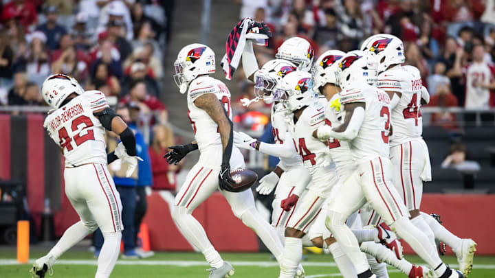 Dec 15, 2024; Glendale, Arizona, USA; Arizona Cardinals cornerback Sean Murphy-Bunting (23) celebrates an interception with teammates against the New England Patriots in the second half at State Farm Stadium. Mandatory Credit: Mark J. Rebilas-Imagn Images