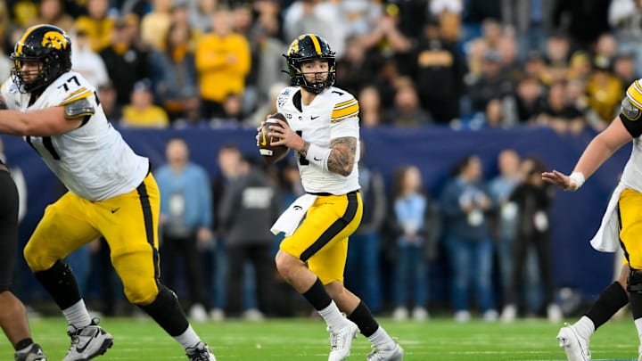 Dec 30, 2024; Nashville, TN, USA;  Iowa Hawkeyes quarterback Brendan Sullivan (1) stands in the pocket against the Missouri Tigers during the second half at Nissan Stadium. Mandatory Credit: Steve Roberts-Imagn Images