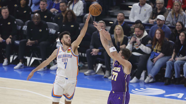 Nov 12, 2025; Oklahoma City, Oklahoma, USA; Oklahoma City Thunder center Chet Holmgren (7) defends a shot by Los Angeles Lakers guard Luka Doncic (77) during the first quarter at Paycom Center. Mandatory Credit: Alonzo Adams-Imagn Images