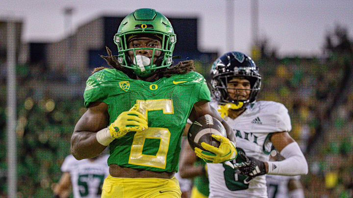 Oregon   s Noah Whittington carries the ball for a touchdown as the Oregon Ducks host Hawaii Saturday, Sept. 16, 2023, at Hayward Field in Eugene, Ore.
