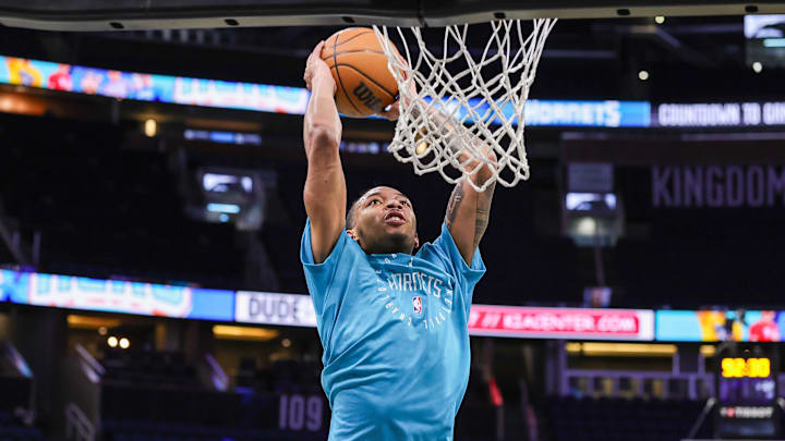 Feb 12, 2025; Orlando, Florida, USA; Charlotte Hornets guard Nick Smith Jr. (8) warms up before the game against the Orlando Magic at Kia Center. Mandatory Credit: Mike Watters-Imagn Images Feb 12, 2025; Orlando, Florida, USA; Charlotte Hornets guard Nick Smith Jr. (8) warms up before the game against the Orlando Magic at Kia Center. Mandatory Credit: Mike Watters-Imagn Images
