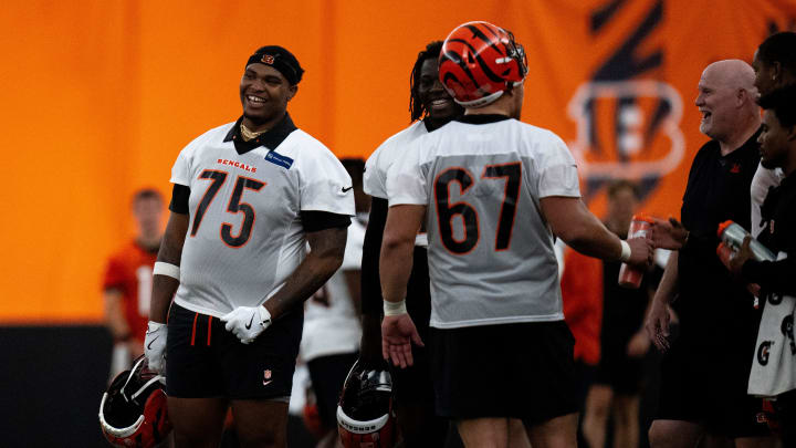 Cincinnati Bengals offensive tackle Orlando Brown Jr. (75) laughs at Bengals spring practice at the IEL Indoor Facility in Cincinnati on Thursday, June 13, 2024.