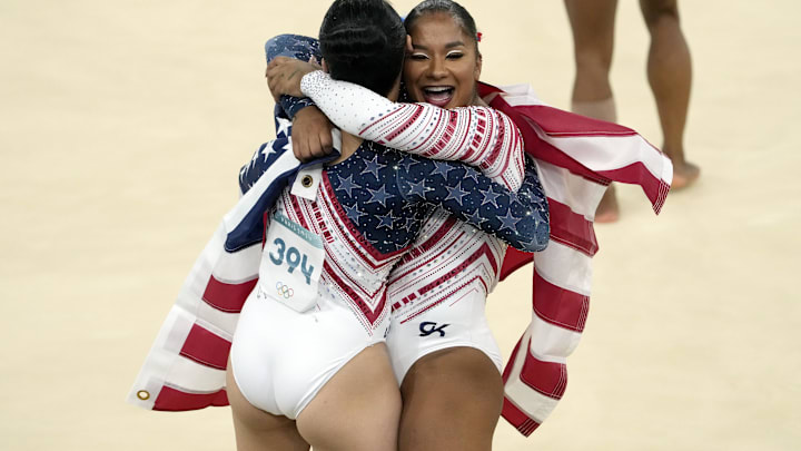 Jul 30, 2024; Paris, France; Jordan Chiles (right) and Sunisa Lee of the United States celebrate winning gold in the women’s team final at the Paris 2024 Olympic Summer Games at Bercy Arena. 