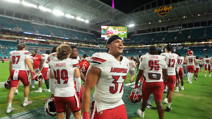 Oct 17, 2025; Miami Gardens, Florida, USA; Louisville Cardinals linebacker Jaxon Panariello (37) celebrates after winning the game against the Miami Hurricanes at Hard Rock Stadium. Mandatory Credit: Sam Navarro-Imagn Images