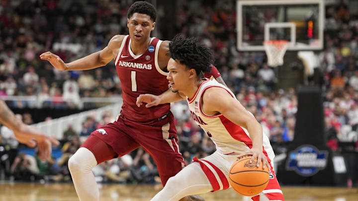 Arizona guard Brayden Burries (5) dribbles the ball against Arkansas guard Meleek Thomas (1) in the second half during a Sweet Sixteen game of the West Regional of the men's 2026 NCAA Tournament at SAP Center. Arizona guard Brayden Burries (5) dribbles the ball against Arkansas guard Meleek Thomas (1) in the second half during a Sweet Sixteen game of the West Regional of the men's 2026 NCAA Tournament at SAP Center.