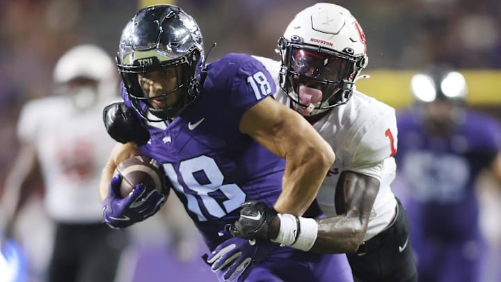 Oct 4, 2024; Fort Worth, Texas, USA; TCU Horned Frogs wide receiver Jack Bech (18) breaks the tackle of Houston Cougars defensive back Latrell McCutchin Sr. (1) and scores a touchdown in the fourth quarter at Amon G. Carter Stadium. Mandatory Credit: Tim Heitman-Imagn Images Oct 4, 2024; Fort Worth, Texas, USA; TCU Horned Frogs wide receiver Jack Bech (18) breaks the tackle of Houston Cougars defensive back Latrell McCutchin Sr. (1) and scores a touchdown in the fourth quarter at Amon G. Carter Stadium. Mandatory Credit: Tim Heitman-Imagn Images