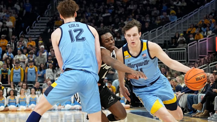 Marquette guard Tyler Kolek (11) takes advantage of a pick by forward Ben Gold (12) on guard Jayden Pierre (1) during the first half of their game Wednesday, February 28, 2024 at Fiserv Forum in Milwaukee, WisconsinMark Hoffman/Milwaukee Journal Sentinel Marquette guard Tyler Kolek (11) takes advantage of a pick by forward Ben Gold (12) on guard Jayden Pierre (1) during the first half of their game Wednesday, February 28, 2024 at Fiserv Forum in Milwaukee, WisconsinMark Hoffman/Milwaukee Journal Sentinel